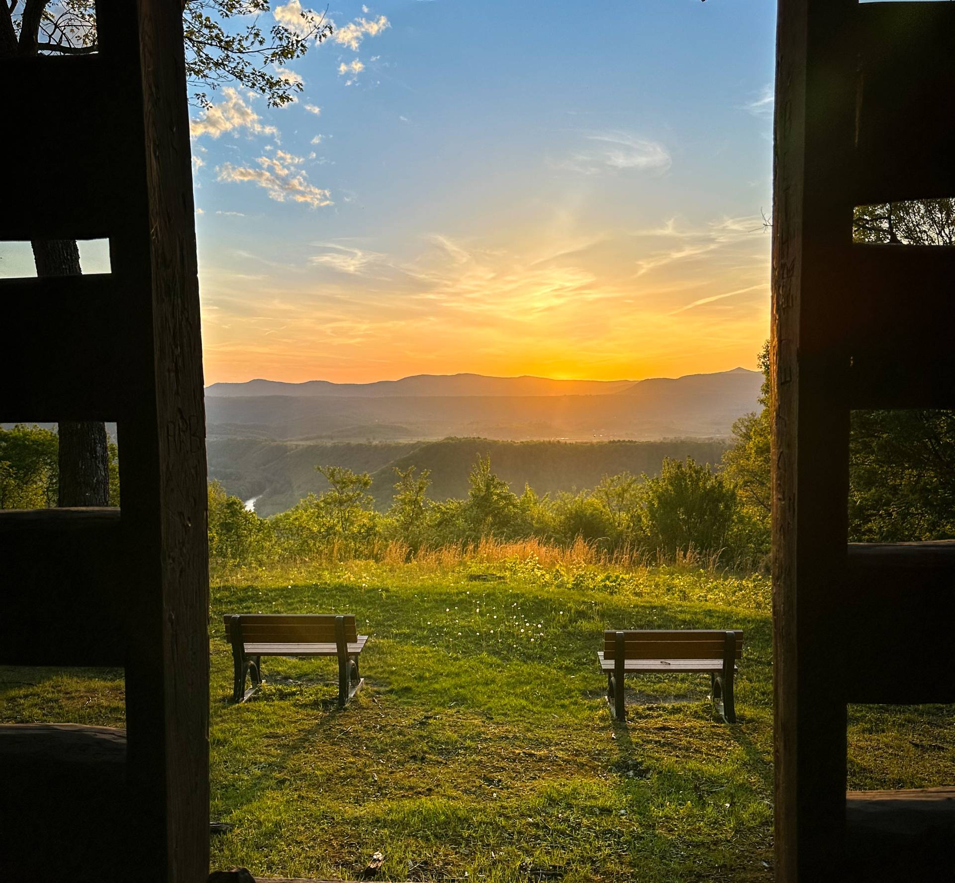 wv tourism sunset in the window with chairs